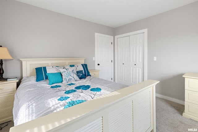 bedroom featuring a closet and light carpet