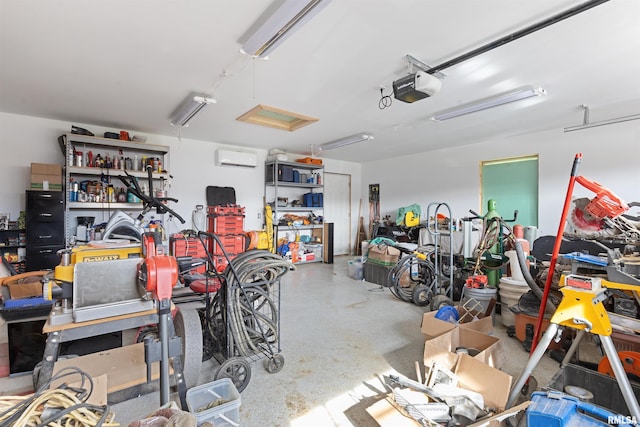 garage with a garage door opener and an AC wall unit