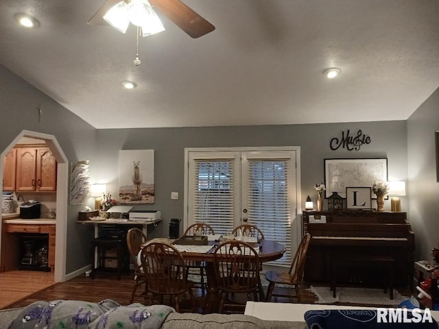 dining area featuring ceiling fan and dark hardwood / wood-style flooring