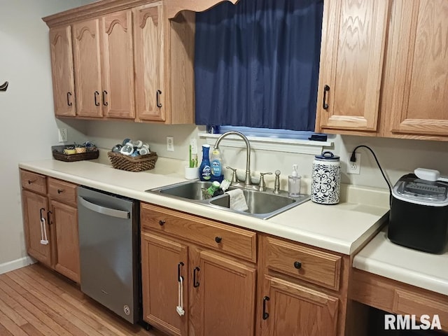 kitchen with dishwasher, light wood-type flooring, and sink