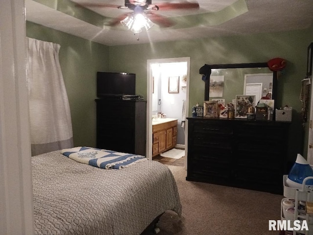 506 N Locust St, Sesser, IL 62884 - carpeted bedroom featuring a ceiling fan and ensuite bathroom
