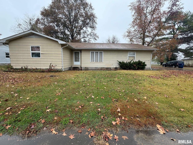 single story home with a front yard