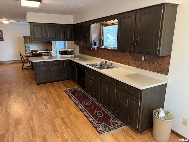 309 E Gelston St, Valier, IL 62891 - kitchen with black dishwasher, white microwave, and light countertops