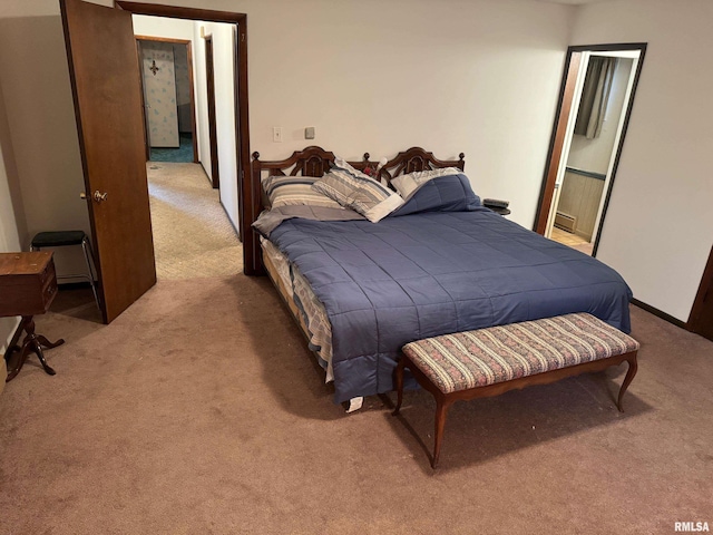 309 E Gelston St, Valier, IL 62891 - bedroom with light carpet and a baseboard heating unit