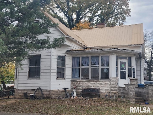 300 S Locust St, Mcleansboro, IL 62859 - view of side of home with a chimney and a metal roof