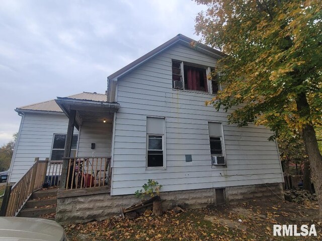300 S Locust St, Mcleansboro, IL 62859 - rear view of property with a metal roof