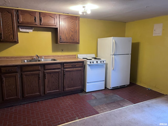 kitchen with white appliances and sink