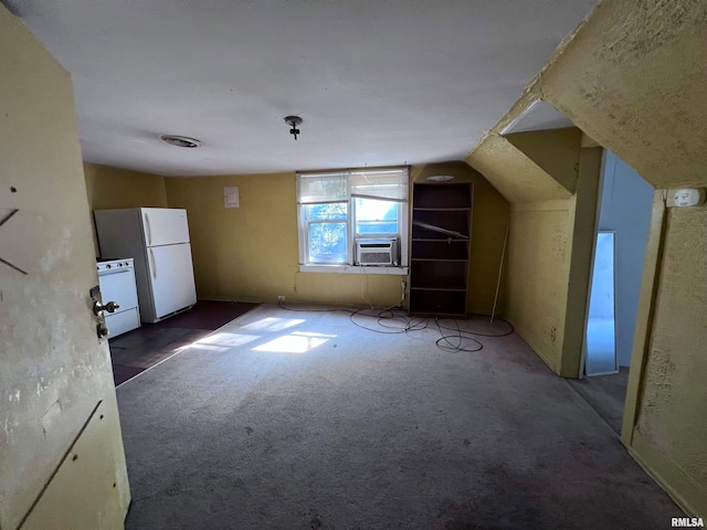 bonus room with vaulted ceiling and cooling unit