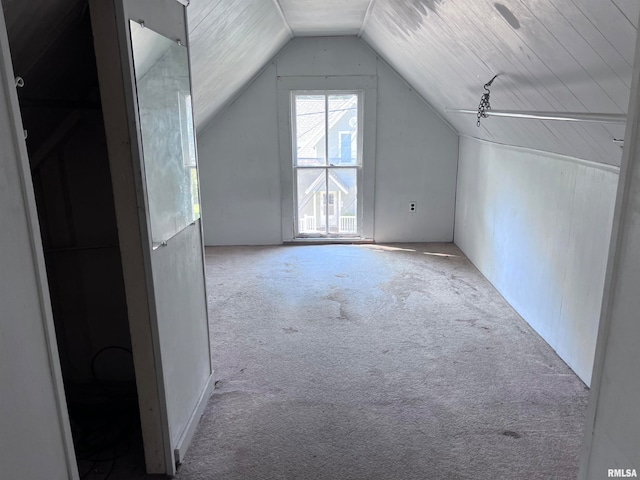 bonus room featuring light carpet, vaulted ceiling, and wood ceiling