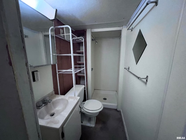 bathroom featuring vanity, toilet, and walk in shower