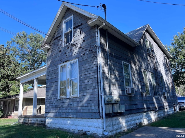 view of side of property featuring cooling unit