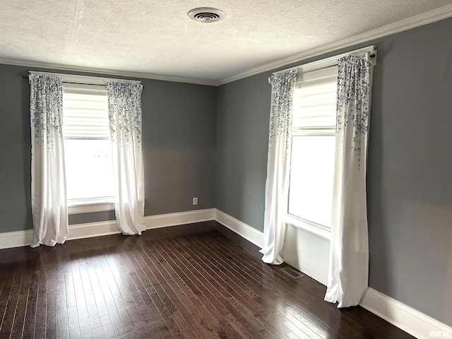 unfurnished room featuring ornamental molding, a textured ceiling, and dark wood-type flooring