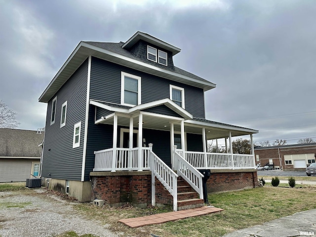 view of front of property featuring a porch and central AC