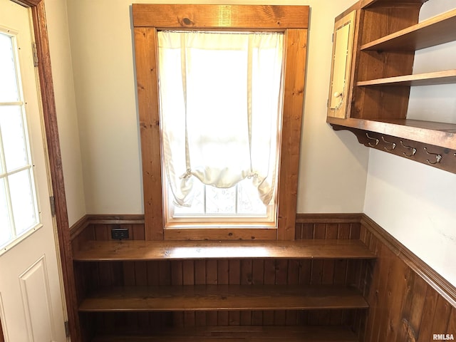 bedroom with ceiling fan, crown molding, and dark colored carpet