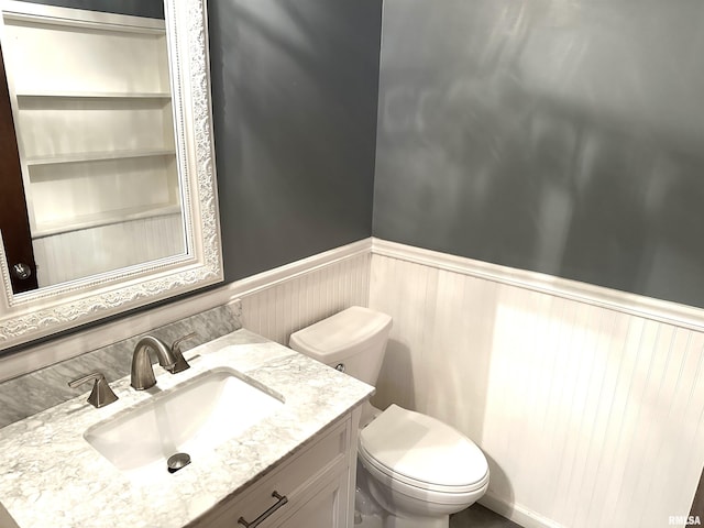 bedroom with a textured ceiling, dark carpet, ceiling fan, and ornamental molding