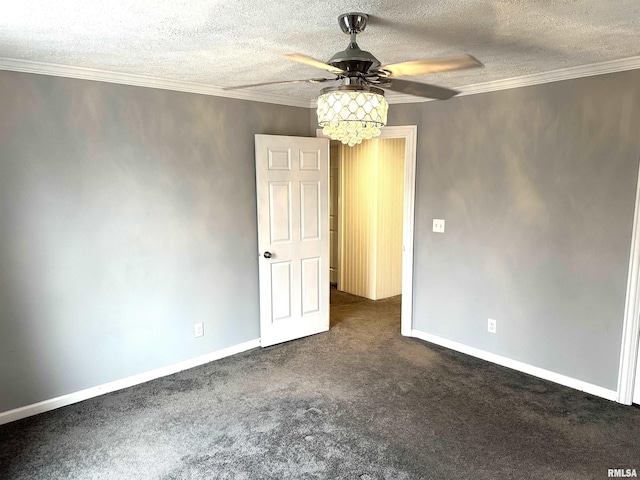 carpeted empty room with ceiling fan, ornamental molding, and a textured ceiling