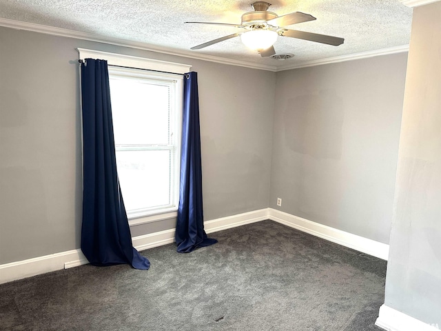 carpeted spare room featuring a wealth of natural light, ornamental molding, and ceiling fan