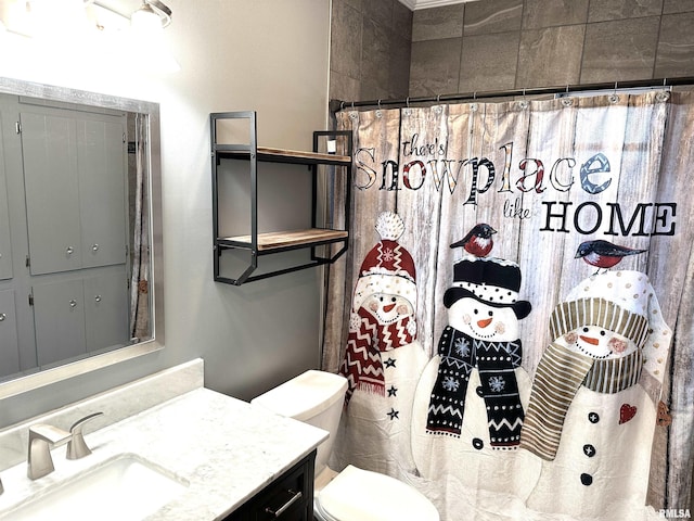 bathroom with a shower with curtain, vanity, and toilet