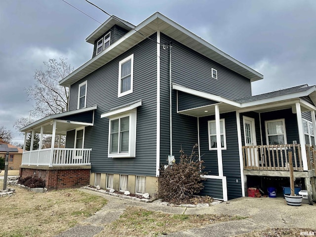 view of property exterior featuring a porch