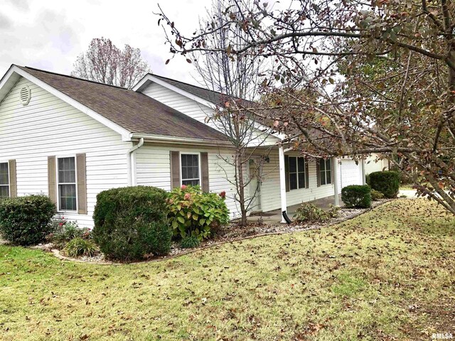 view of property exterior with a lawn