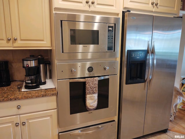 20366 Noisy Goose Ln, Olive Branch, IL 62969 - kitchen with appliances with stainless steel finishes, a warming drawer, decorative backsplash, and stone countertops
