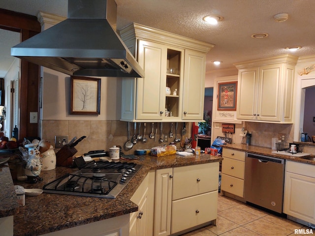 20366 Noisy Goose Ln, Olive Branch, IL 62969 - kitchen with stainless steel appliances, wall chimney range hood, light tile patterned flooring, tasteful backsplash, and a textured ceiling