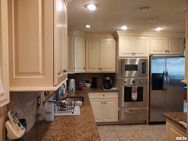 20366 Noisy Goose Ln, Olive Branch, IL 62969 - kitchen with appliances with stainless steel finishes, a warming drawer, light tile patterned floors, backsplash, and recessed lighting