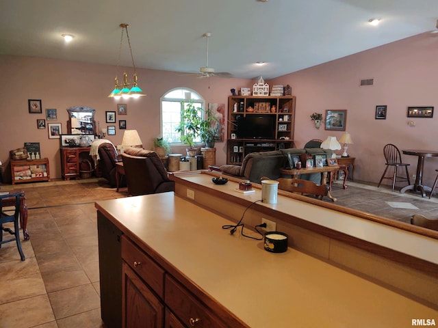 20366 Noisy Goose Ln, Olive Branch, IL 62969 - kitchen with open floor plan, ceiling fan, light tile patterned floors, hanging light fixtures, and vaulted ceiling