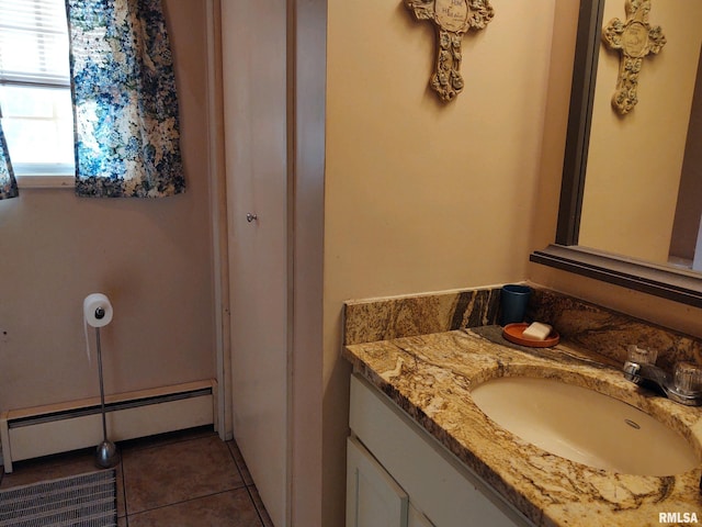 20366 Noisy Goose Ln, Olive Branch, IL 62969 - bathroom featuring a baseboard heating unit, vanity, and tile patterned flooring