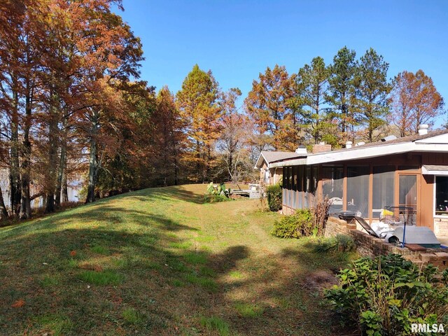 20366 Noisy Goose Ln, Olive Branch, IL 62969 - view of green lawn featuring a sunroom