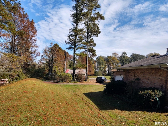 20366 Noisy Goose Ln, Olive Branch, IL 62969 - view of green lawn featuring a garage