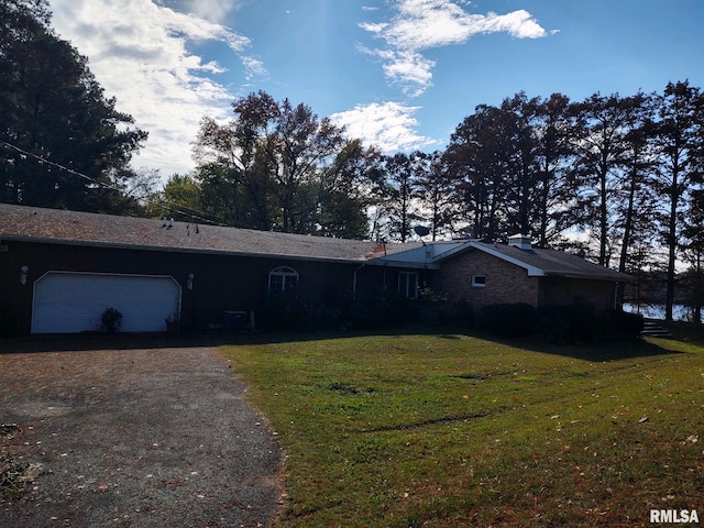 20366 Noisy Goose Ln, Olive Branch, IL 62969 - single story home with a front yard, dirt driveway, and an attached garage