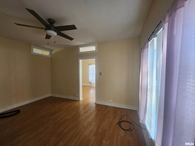 spare room with hardwood / wood-style flooring and ceiling fan