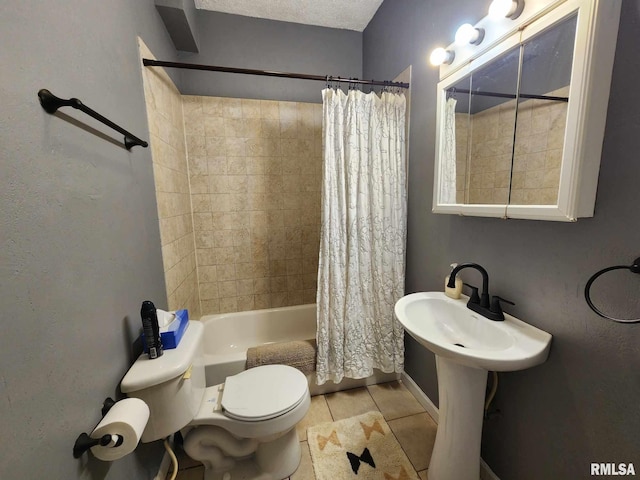 bathroom featuring tile patterned flooring, shower / bath combination with curtain, a textured ceiling, and toilet