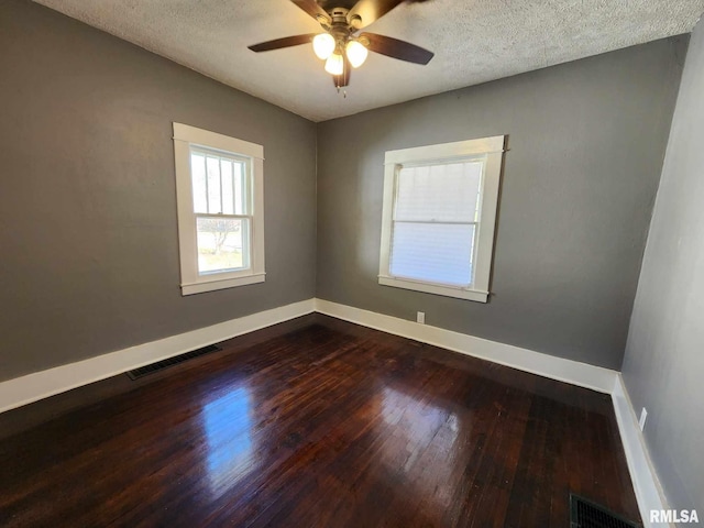 unfurnished room featuring a textured ceiling, hardwood / wood-style flooring, and ceiling fan