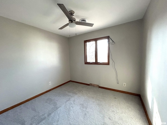 carpeted empty room with ceiling fan