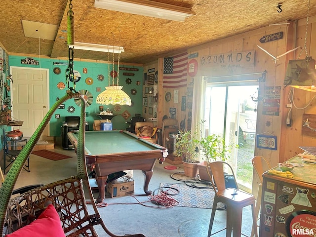 recreation room with concrete flooring, a healthy amount of sunlight, and billiards