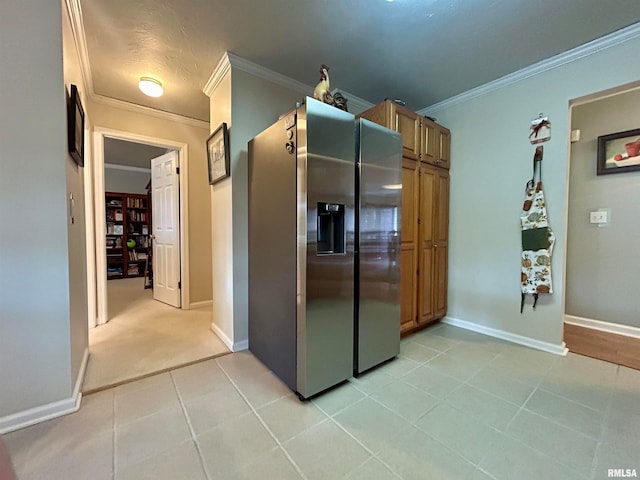 corridor featuring light tile patterned floors and ornamental molding