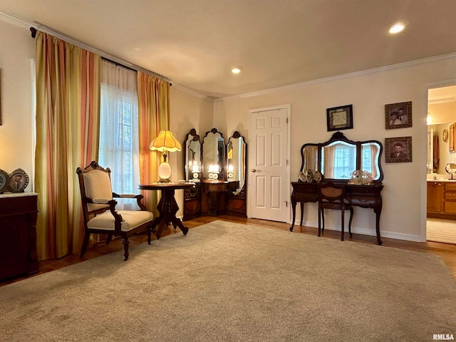 living area featuring plenty of natural light and crown molding