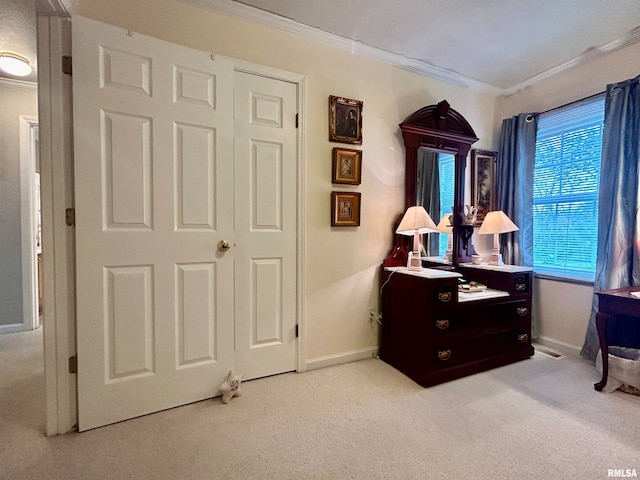 misc room with light colored carpet and crown molding