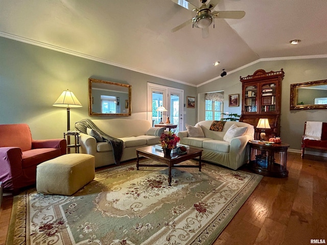 living room featuring hardwood / wood-style floors, ceiling fan, lofted ceiling, and crown molding