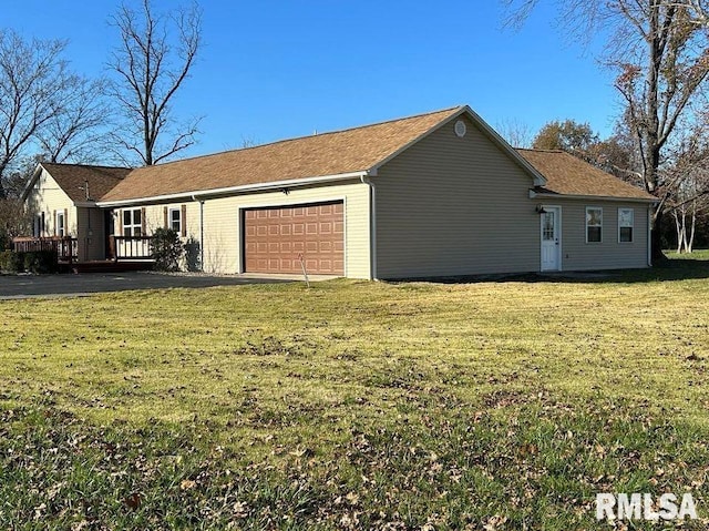 exterior space with a front lawn and a garage