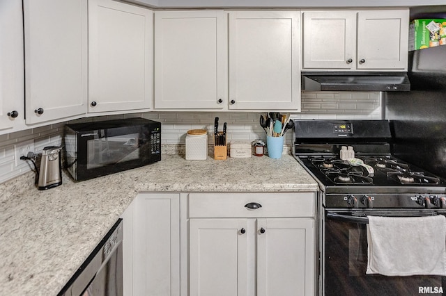 kitchen with tasteful backsplash, light stone counters, white cabinets, and black appliances