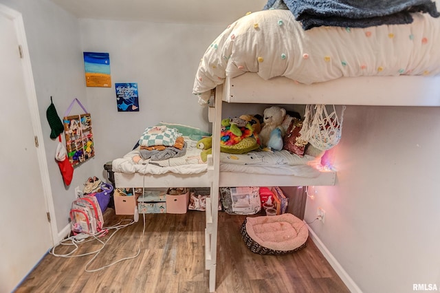 bedroom with hardwood / wood-style floors