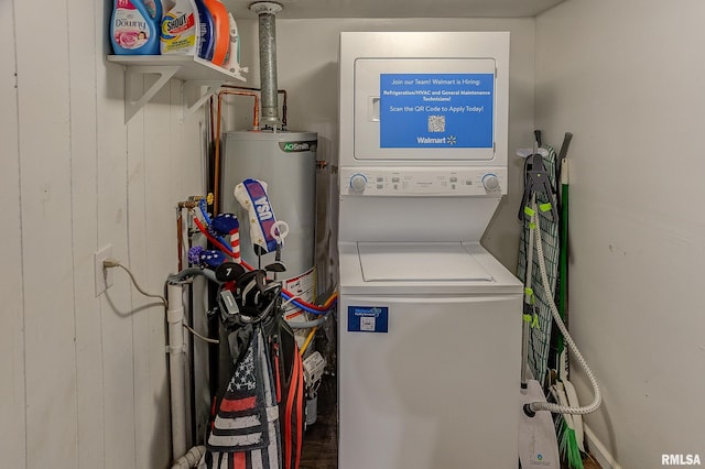 laundry room featuring stacked washer / dryer and gas water heater