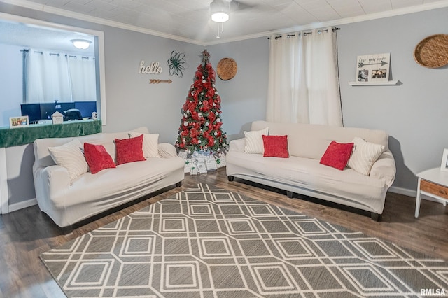 living room featuring dark wood-type flooring, ceiling fan, and crown molding