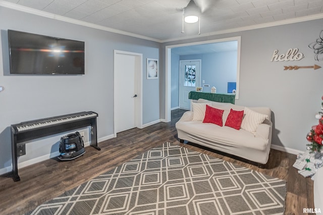 living room with dark hardwood / wood-style flooring and crown molding