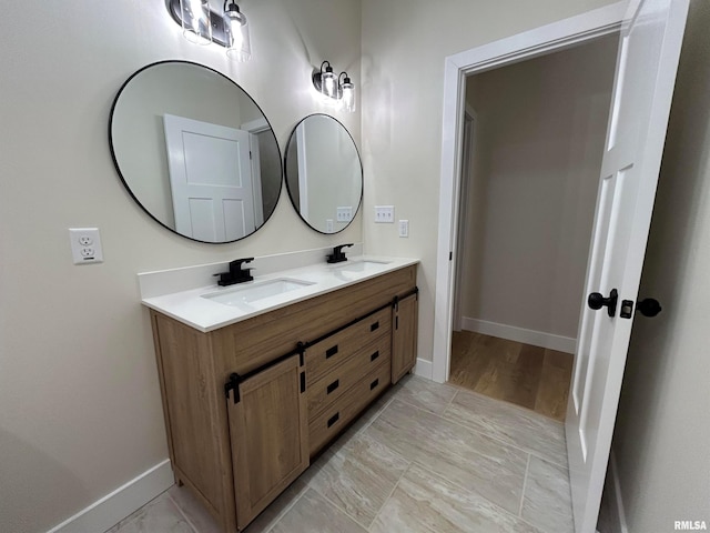 bathroom featuring wood-type flooring and vanity