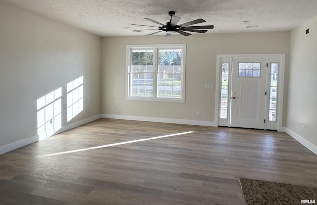 foyer featuring hardwood / wood-style floors, a textured ceiling, and ceiling fan