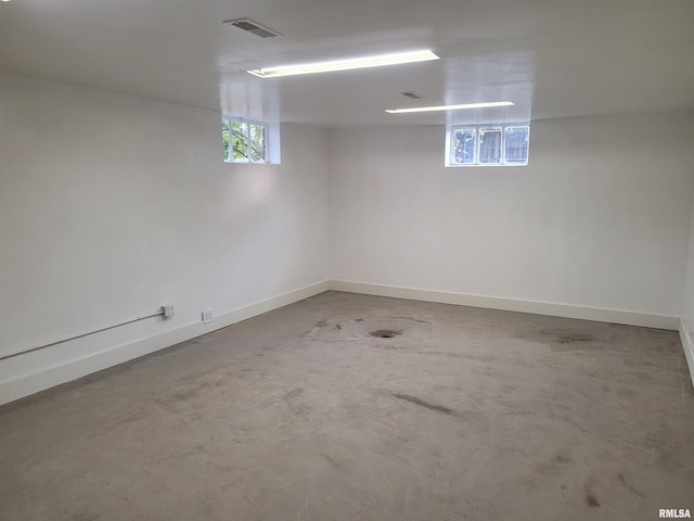 spare room with concrete flooring